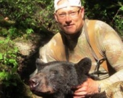 chris-with-bear-265x150